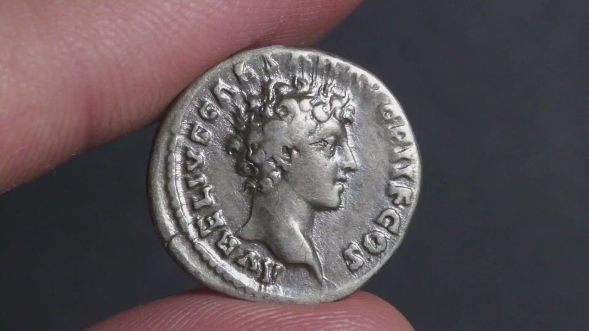 video of marcus aurelius antoninus pius denarius being rotated between fingers to show both sides