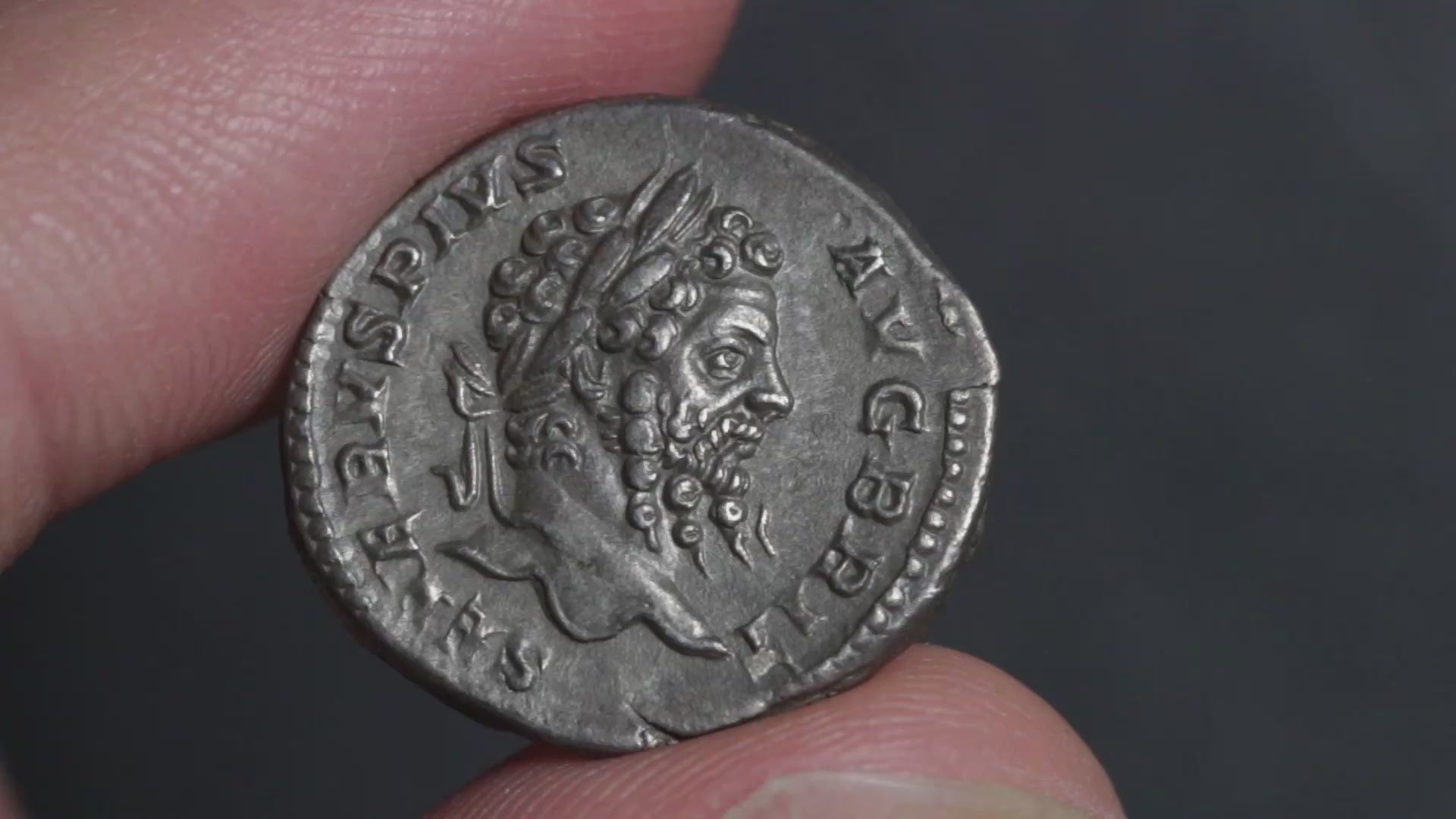 video of the septimius severus denarius being rotated between two fingers to show both sides