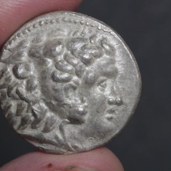 silent video of the alexander tetradrachm coin being rotated between two fingers