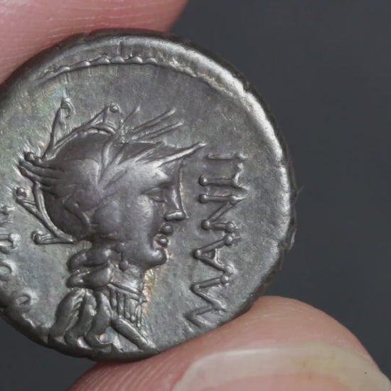 video of the Sulla denarius being rotated between two fingers to show both sides