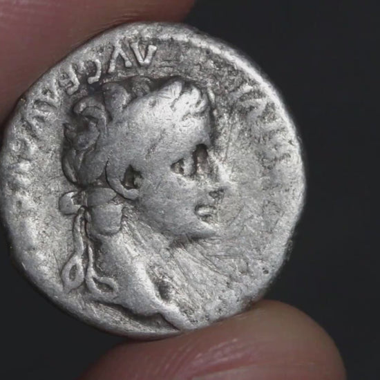 video of tiberius denarius being rotated between two fingers to show both sides