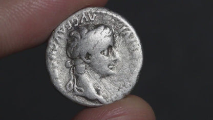 video of tiberius denarius being rotated between two fingers to show both sides