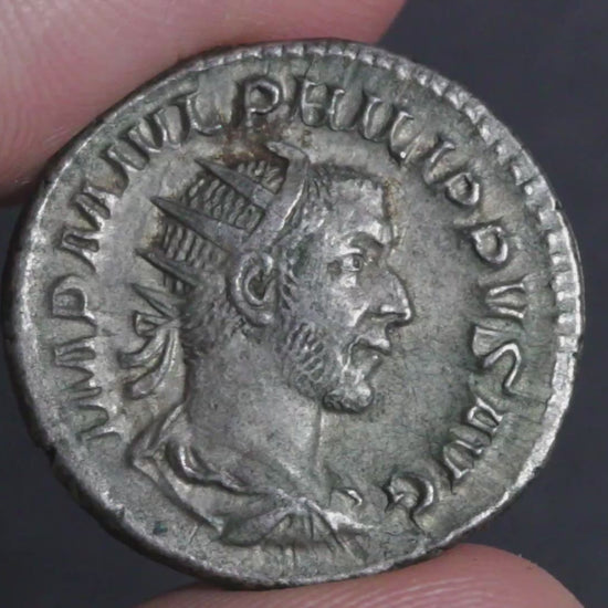 video showing the philip antoninianus being rotated between two fingers to show both sides