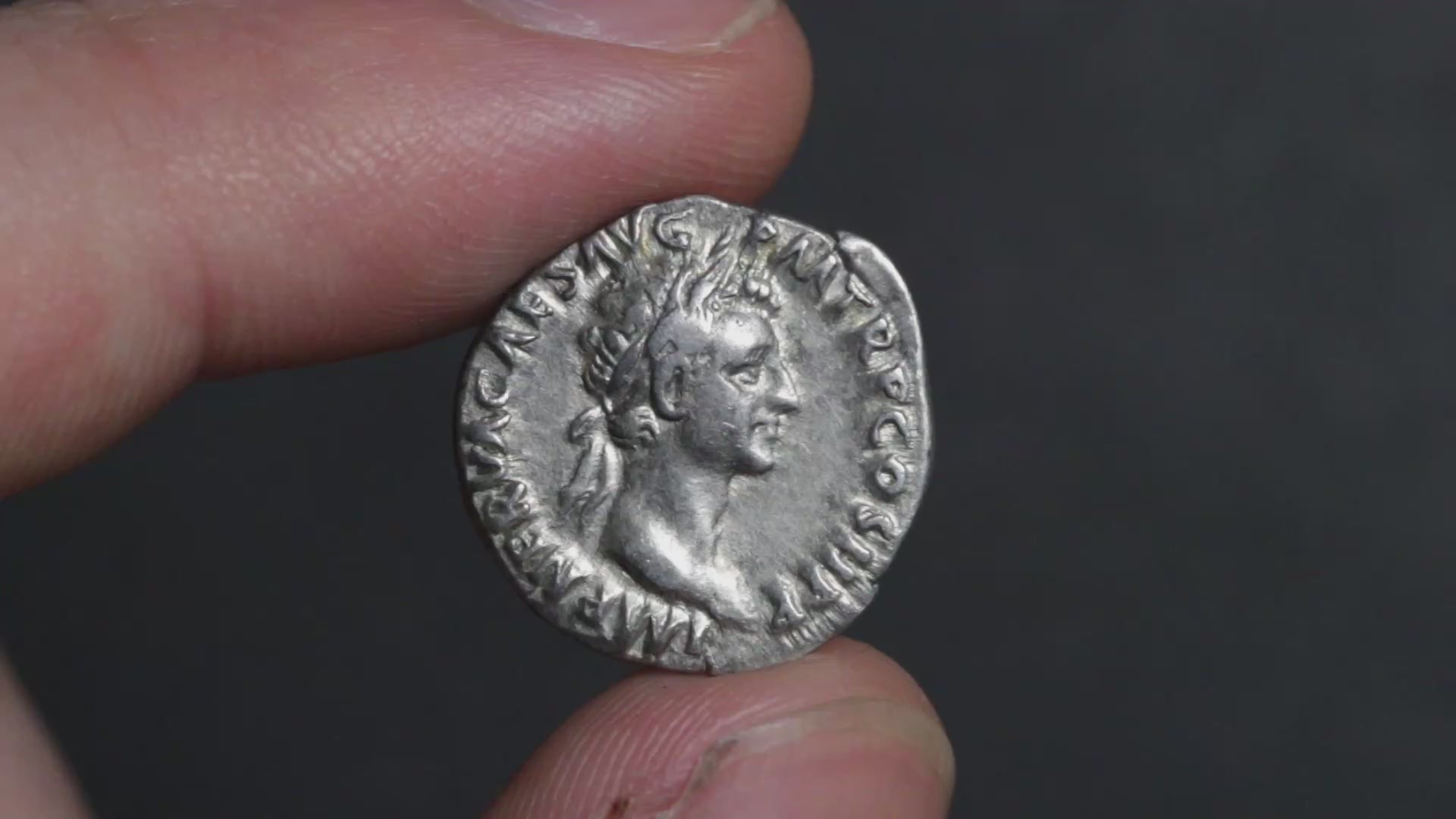 silent video of nerva denarius being rotated between two fingers, showing each side