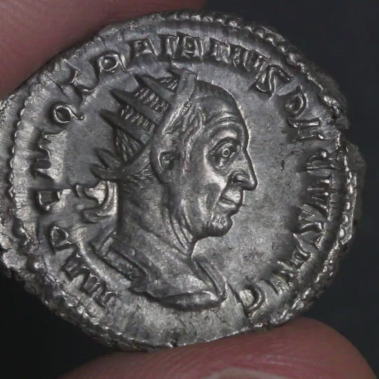 video of trajan decius antoninianus being rotated between two fingers to show both sides