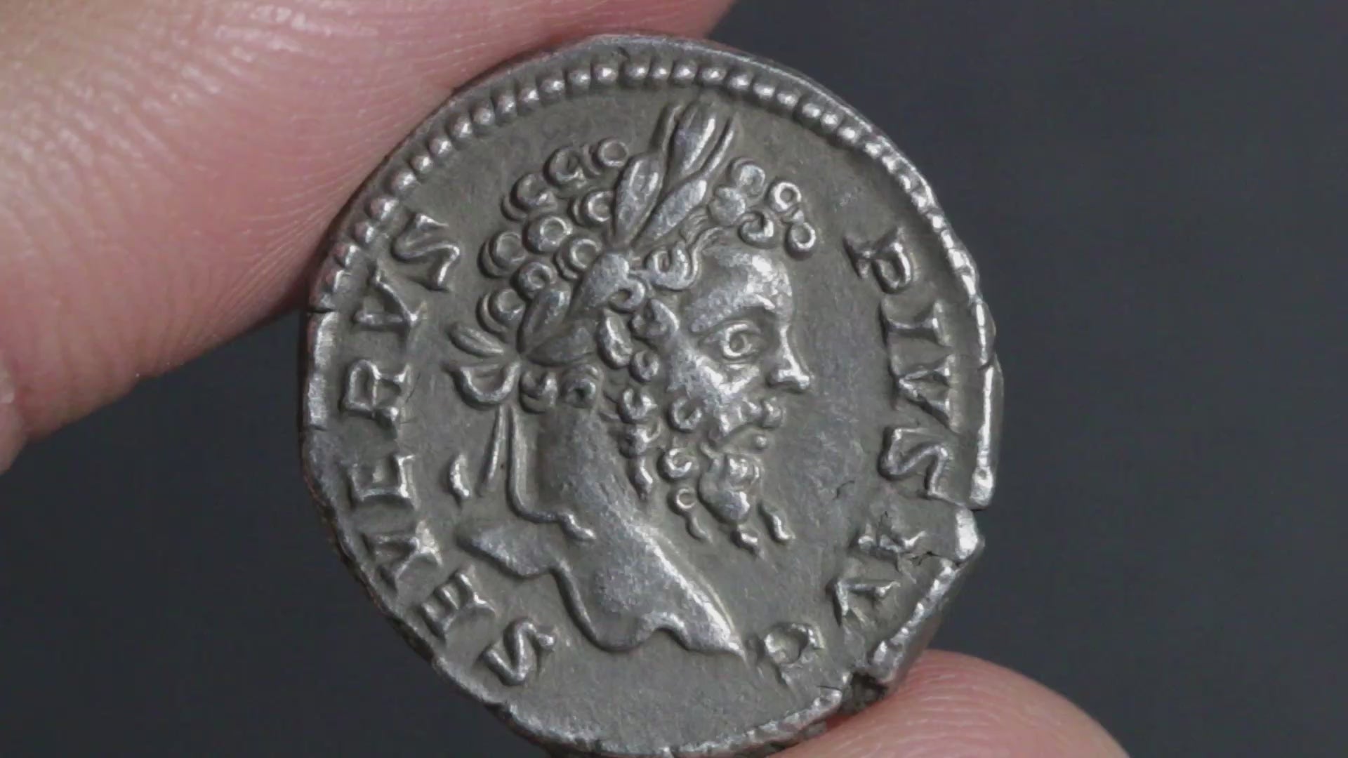 video showing septimius severus denarius being rotated between two fingers