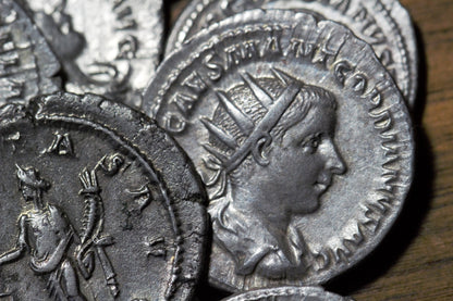 A closeup shot of a Roman silver antoninianus coin